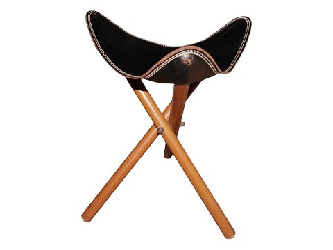 StoolBlack leather and foldable wooden legs