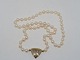 Pearl necklace with 14 carat gold pendant with 8 diamonds