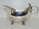 Silver
Gravy boat in heavy quality with flower handle and on four feet